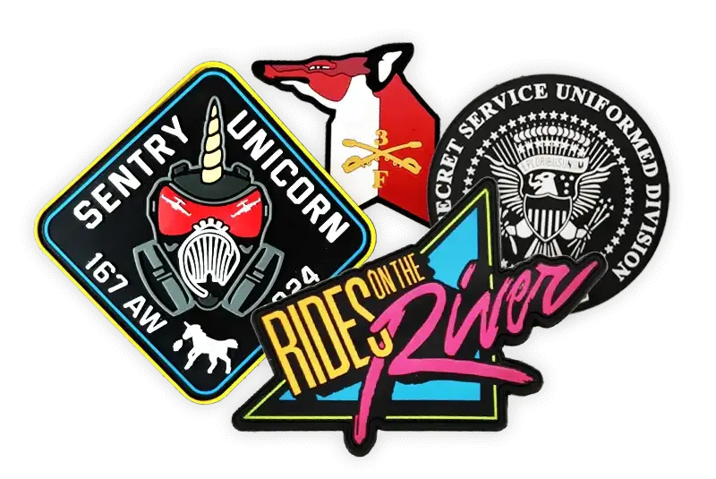 Assorted PVC patches showcasing logos and designs for uniforms and gear.